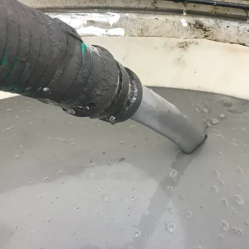 Micron-Size ZVI Suspension in a Shear Thinning Fluid for Groundwater Remediation